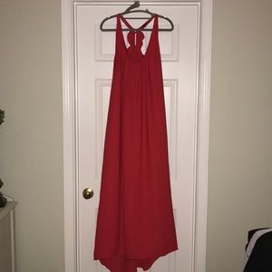 Red flowy halter dress with ruffle back and train